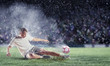 football player striking the ball