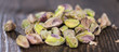 Peeled Pistachios on wood