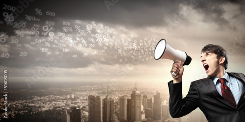 Photo: businessman with megaphone businessman with megaphone
