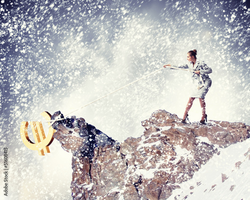 Photo: businesswoman climbing mountain businesswoman climbing mountain