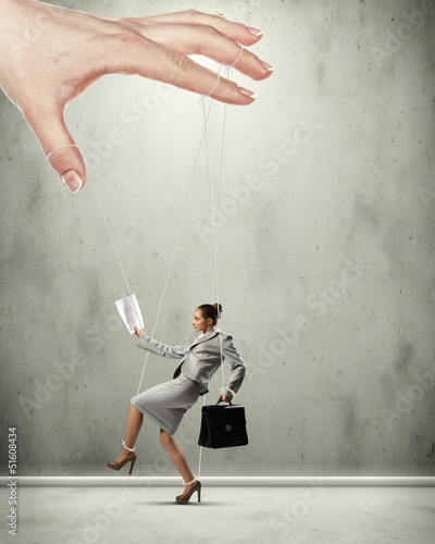 Photo: Business woman marionette Business woman marionette