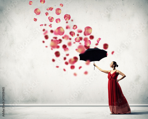 Photo: Ballet dancer in flying satin dress with umbrella Ballet dancer in flying satin dress with umbrella