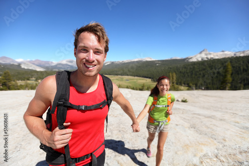 Photo: Hiking couple having fun outdoors in Yosemite, USA Hiking couple having fun outdoors in Yosemite, USA