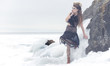 a fashion model posing in a cold winter setting