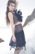 a fashion model posing in a cold winter setting