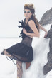 a fashion model posing in a cold winter setting