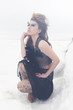 a fashion model posing in a cold winter setting