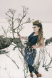 a fashion model posing in a cold winter setting