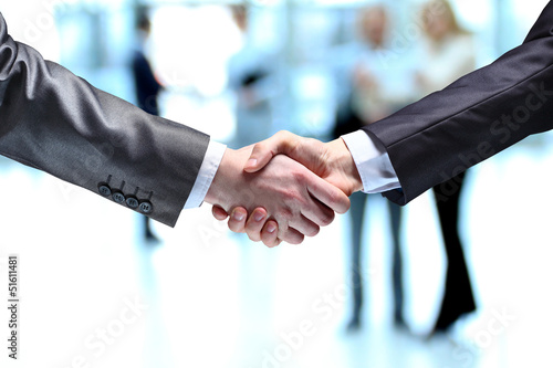 Photo: The businessman. Hand for a handshake. The businessman. Hand for a handshake.