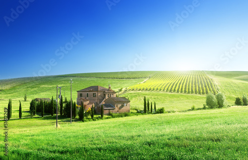 Photo: Tuscany landscape with typical farm house Tuscany landscape with typical farm house