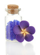 Little bottle full with colorful beads isolated on white