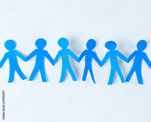 Photo: Team of paper doll people holding hands Team of paper doll people holding hands