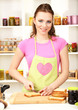 Young woman cooking in kitchen