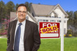 Male Real Estate Agent In Fron...