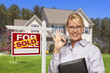 Real Estate Agent in Front of Sold Sign and House