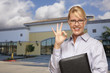 Businesswoman In Front of Vacant Office Building