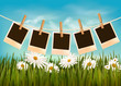 Photos hanging on a rope in front of a nature summer background.