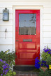 Red front door of an upscale home