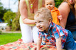 Photo: Mother and grandmother with children in a park Mother and grandmother with children in a park