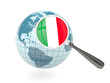 Magnified flag of italy with blue globe