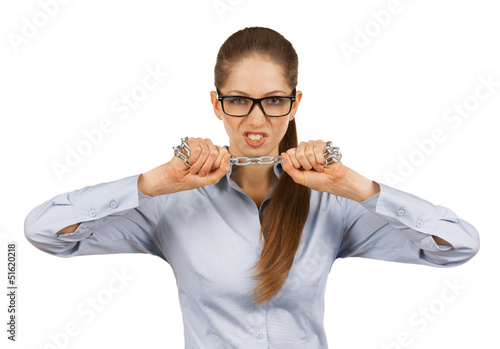 Photo: Young woman trying to break a steel chain Young woman trying to break a steel chain