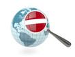 Illustration: Magnified flag of latvia with blue globe Magnified flag of latvia with blue globe