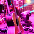 Guitar and other musical equipment on stage before concert