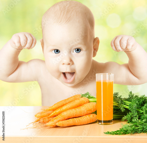 Photo: Child and fresh carrot juice glass. healthy vegetable food Child and fresh carrot juice glass. healthy vegetable food