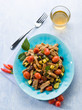 meat stew with tomatoes zucchinis and olives