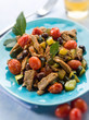 Foto: meat stew with tomatoes zucchinis and olives, selective focus meat stew with tomatoes zucchinis and olives, selective focus