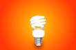 Compact Fluorescent Bulb on green background