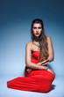 Beautiful fashion young woman in red dress