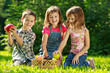 Three happy smiling child playing in park