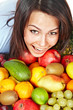Happy girl with group of  fruit.
