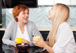 Mother and daudhter talking on the kitchen