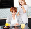 Daughter soothes sad mother