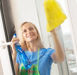 Woman washing window