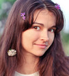 Photo: portrait of beautiful young woman relaxing in summer park portrait of beautiful young woman relaxing in summer park