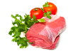 Piece of raw beef with parsley and tomatoes - isolated on white