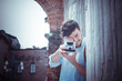 stylish man in the street with old camera
