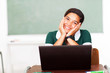 smiling teen middle school girl using computer