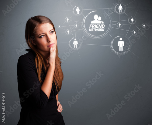 Photo: Attractive girl looking at modern social network Attractive girl looking at modern social network