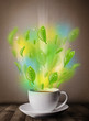 Tea cup with leaves and colorful abstract lights