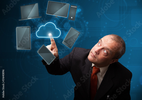Photo: Businessman touching high technology cloud service Businessman touching high technology cloud service