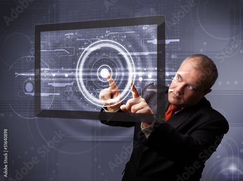 Photo: Businessman touching modern technology tablet Businessman touching modern technology tablet