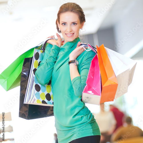 Photo: Shopping woman with color bags Shopping woman with color bags