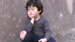 Homeless poor little boy