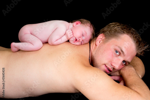 Photo: Baby on father's back Baby on father's back