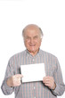 Senior man holding a blank card
