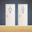 Toilet doors on vintage wall background. 